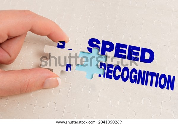 Text caption presenting Speed Recognition. Business\
concept technology used to detect and recognize over speeding car\
Building An Unfinished White Jigsaw Pattern Puzzle With Missing\
Last Piece