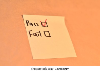 Text checked pass and fail on the short note texture background