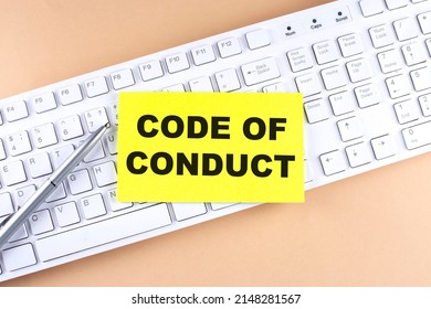 Text CODE OF CONDUCT text on sticky on keyboard, business concept