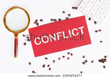The text of the conflict is on a red card, coffee beans and a magnifying glass on a white background are scattered nearby.
