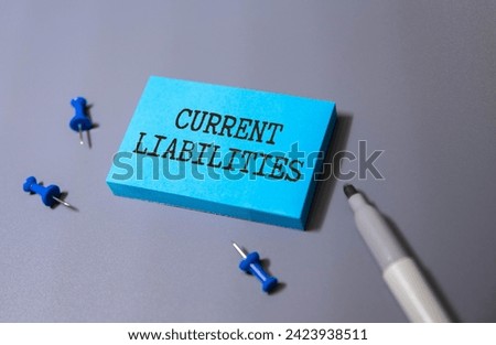 text Current Liabilities on white paper