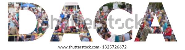 Text cutout reads DACA, or  Deferred Action for\
Childhood Arrivals issue. Background blur of crowd of people, as\
are gathered at the southern border of the USA, waiting to get into\
the country