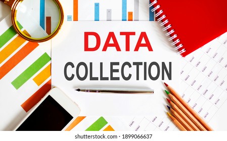 Text DATA COLLECTION on the notepad with office tools, pen on financial report
