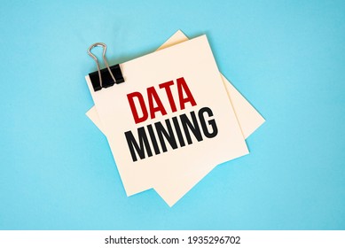 Text DATA MINING On Sticky Notes With Copy Space And Paper Clip Isolated On Red Background.Finance And Economics Concept.