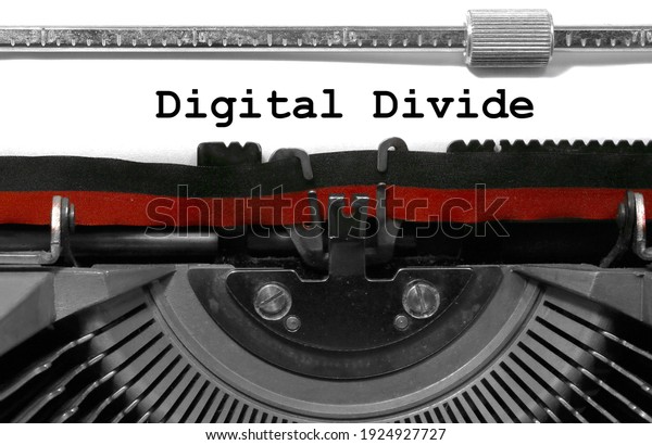 Text\
Digital Divide written with the vintage\
typewriter