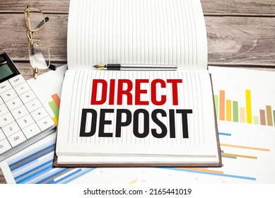 Text Direct Deposit On Brown Diary With Calculator, Glasses On Wooden Background