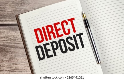 Text Direct Deposit On Brown Diary With Calculator, Glasses On Wooden Background