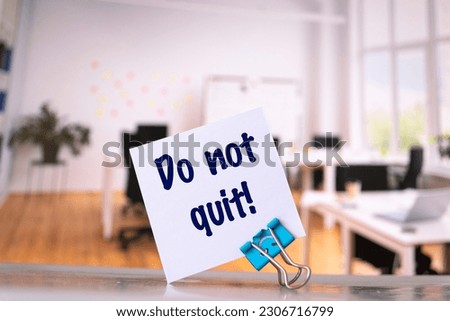 Text Do not quit! on the short note texture background