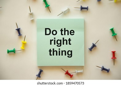 Text Do The Right Thing Is Written On A Blue Sticker Which Lies On A White Background, There Are Multicolored Buttons Next To It. High Quality Photo