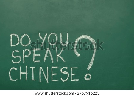Text DO YOU SPEAK CHINESE? on green chalkboard