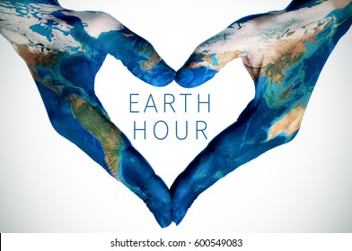 The Text Earth Hour And The Hands Of A Young Woman, Patterned With A World Map (furnished By NASA), Forming A Heart