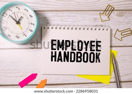 Text Employee handbook on white paper business concept.