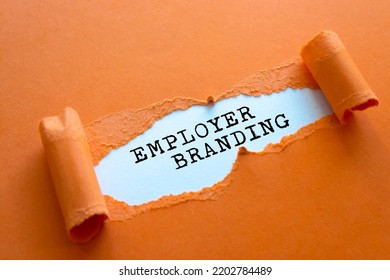 The text Employer Branding appearing behind torn brown paper
