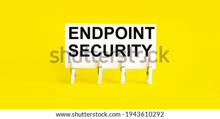 text Endpoint Security on the white short note paper yellow background