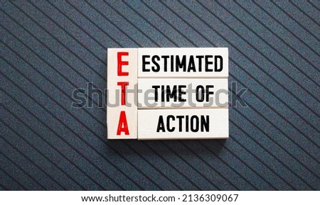 text estimated time of action on wooden block.