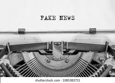 text FAKE NEWS is typed on old paper by a vintage typewriter