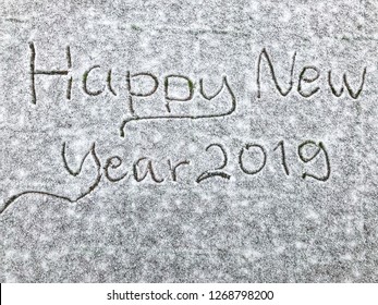 Text from handwriting happy new year 2019 on Snow White background texture. Use for greeting card or poster. With copy space for text a happy new year 2019.