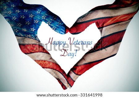 the text happy veterans day and the hands of a young woman forming a heart patterned with the flag of the United States