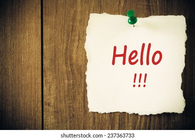 Text Hello on the  paper note.