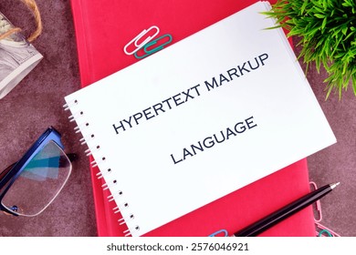 Text hypertext markup language on a white notebook sheet.