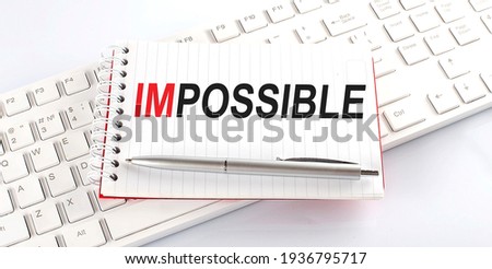 text IMPOSSIBLE on keyboard on white background