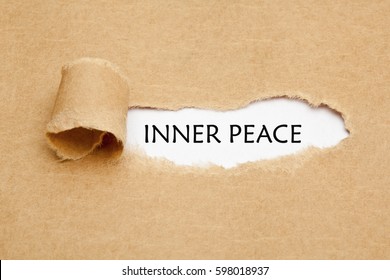 Text Inner Peace Appearing Behind Torn Brown Paper. 