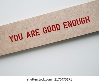 Text Inscription On Wood On Copy Space White Background YOU ARE GOOD ENOUGH, Positive Mantra To Overcome Self-doubt And Negative Thought, Affirmation To Boost Self Esteem And Acceptance