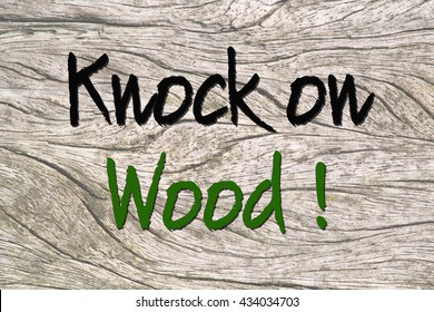 Text Knock On Wood Saying On A Wooden Background