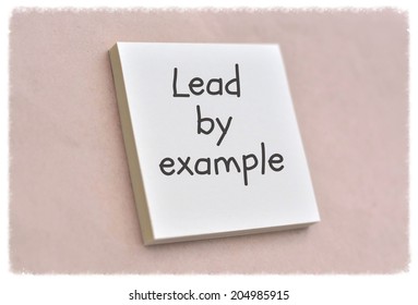 Text lead by example on the short note texture background