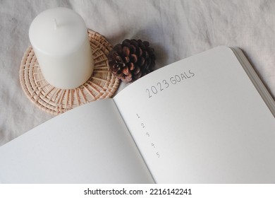 Text List 2023 Goals On Notebook With Pen On White Background, Office Desk. Journal,