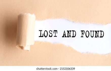 The Text LOST AND FOUND Appears On A Torn Paper On White Background.