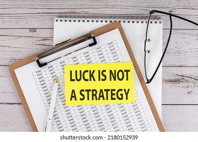 Text LUCK IS NOT A STRATEGY Text On Sticky On Keyboard, Business Concept