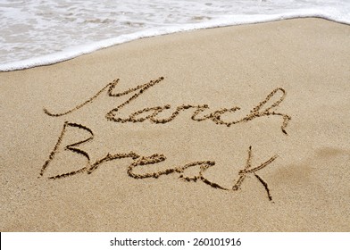 The Text March Break Written In The Sand Of A Beach