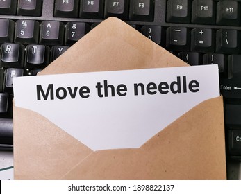 Text MOVE THE NEEDLE written on white paper note in the envelope on computer keyboard.Business concept. - Shutterstock ID 1898822137