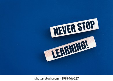 Text Never Stop Learning on a wooden blocks. Education concept.