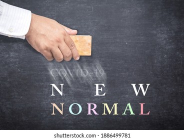 Text For New Normal And Doctor Hand Erasing Covid-19 From A Chalkboard