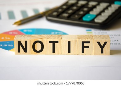  text notify written on a blue background near a magnifying glass and and a calculator. High quality photo - Shutterstock ID 1779870068