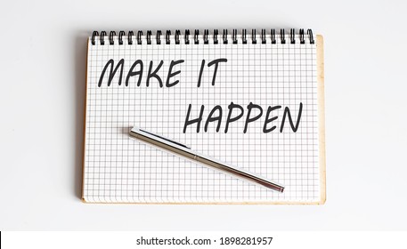 Text on notepad MAKE IT HAPPEN on white background. Business