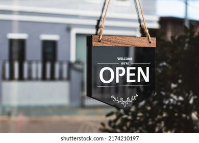 Text on vintage black sign "Come in we're open" in cafe. - Shutterstock ID 2174210197