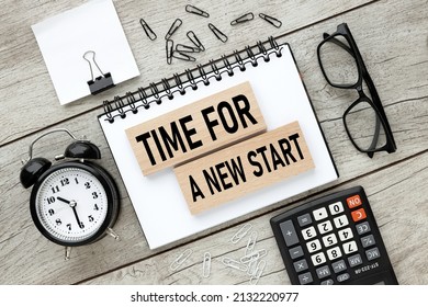text on wooden blocks on a notepad. business concept. Time for A New Start - Shutterstock ID 2132220977