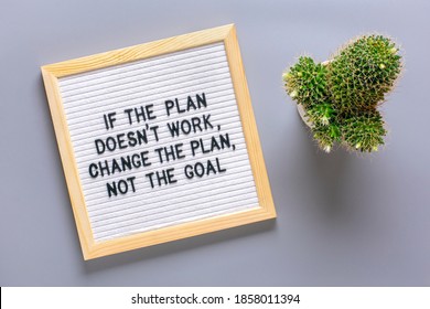 Text - If the plan doesn't work change the plan but not the goal Motivational quotes on message felt board, cactus on gray background Self motivation, achievement, success concept Top view Flat lay