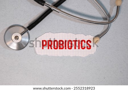 Text probiotics text on a notebook on the doctor's desk next to it is a stethoscope
