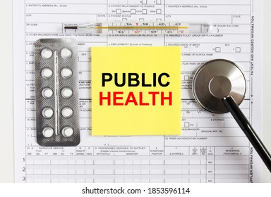 Text Public Health On Yellow Sticker With A Stethoscope And Pills Are On Medical Documents. Medical Concept Photo