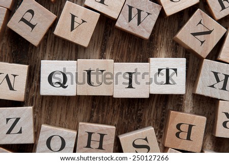 text of QUIT on cubes
