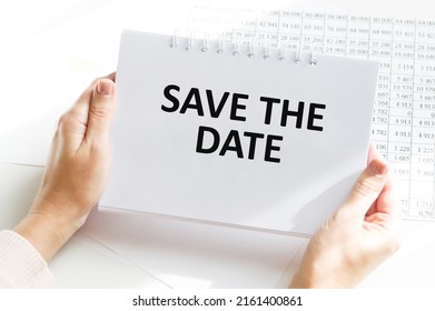 Text Save The Date Text On A Notebook In The Hands Of A Businessman, A Business Concept