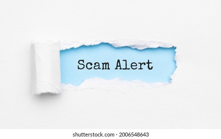 The Text Scam Alert Appearing Behind Torn Yellow Paper