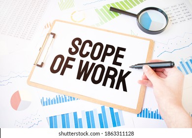 Text Scope Of Work On White Paper Sheet And Marker On Businessman Hand On The Diagram. Business Concept