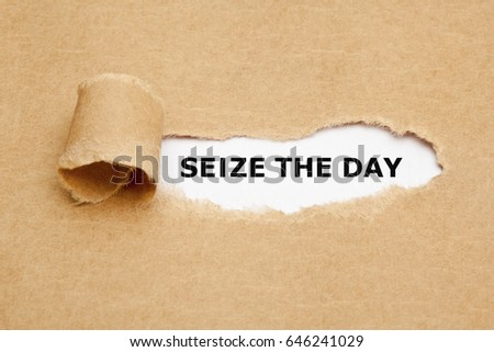 Text Seize The Day appearing behind torn brown paper. 