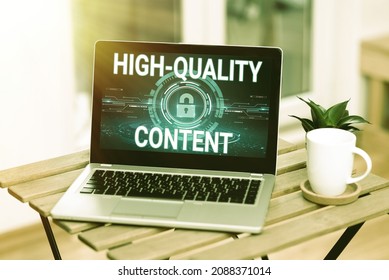 Text showing inspiration High Quality Content. Business approach Website is Useful Informative Engaging to audience Laptop Resting On A Table Beside Coffee Mug And Plant Showing Work Process.
