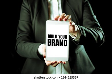 Text sign showing Build Your Brand. Business approach Make a commercial identity Marketing Advertisement - Shutterstock ID 2244825529